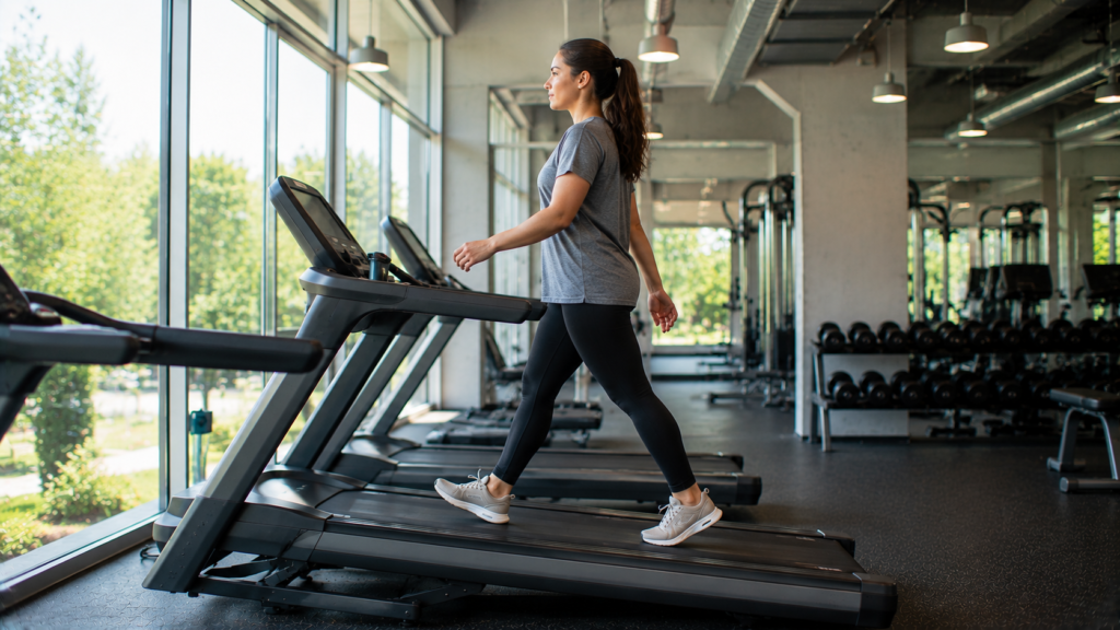 Beginner using a gentle treadmill incline for walking